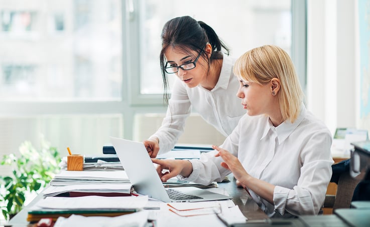 two coworkers working together